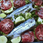 Oven-baked fish with vegetables and potatoes