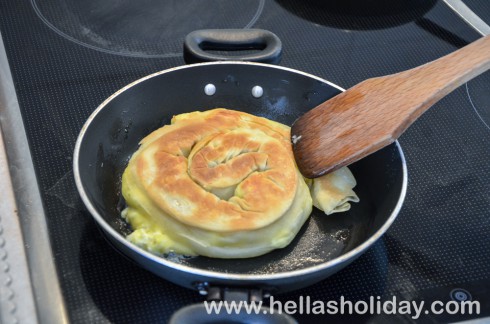 Frying the pie until golden brown, occasionally turning it over